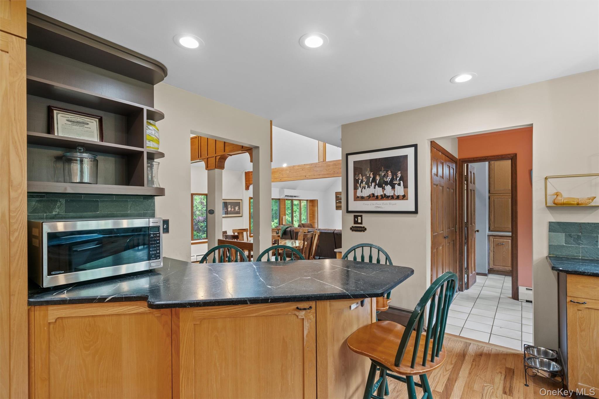 1775 Plank Rd Section A Forestburgh, NY 12777 - Photo 9 of 50 Kitchen featuring stainless steel microwave, a breakfast bar area, a peninsula, light wood-type flooring, and recessed lighting
