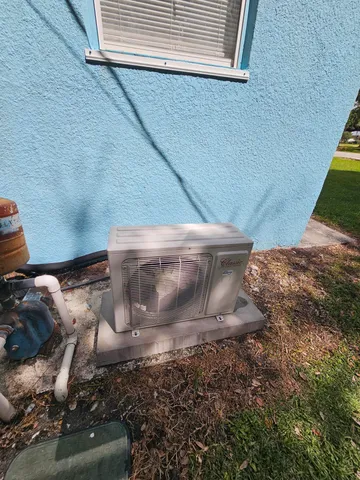an aerial view of a house with pool