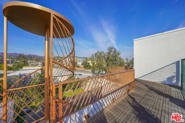 a view of balcony with wooden floor