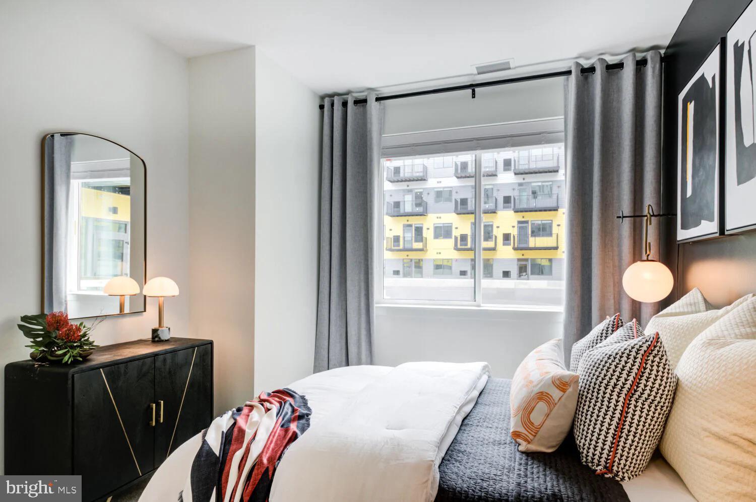 501-31 North Christopher Columbus Boulevard, Unit 1418 Philadelphia, PA 19123 - Photo 26 of 38 a bedroom with a bed and a window