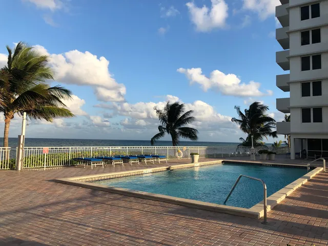 a view of a swimming pool with a terrace