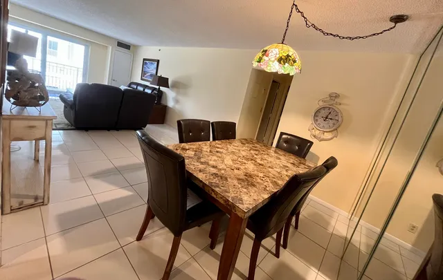 a living room with table and a couch