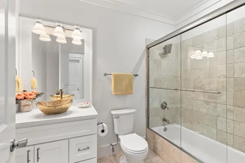 a bathroom with a sink a mirror and a shower