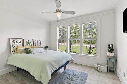 a bedroom with a large bed and a window