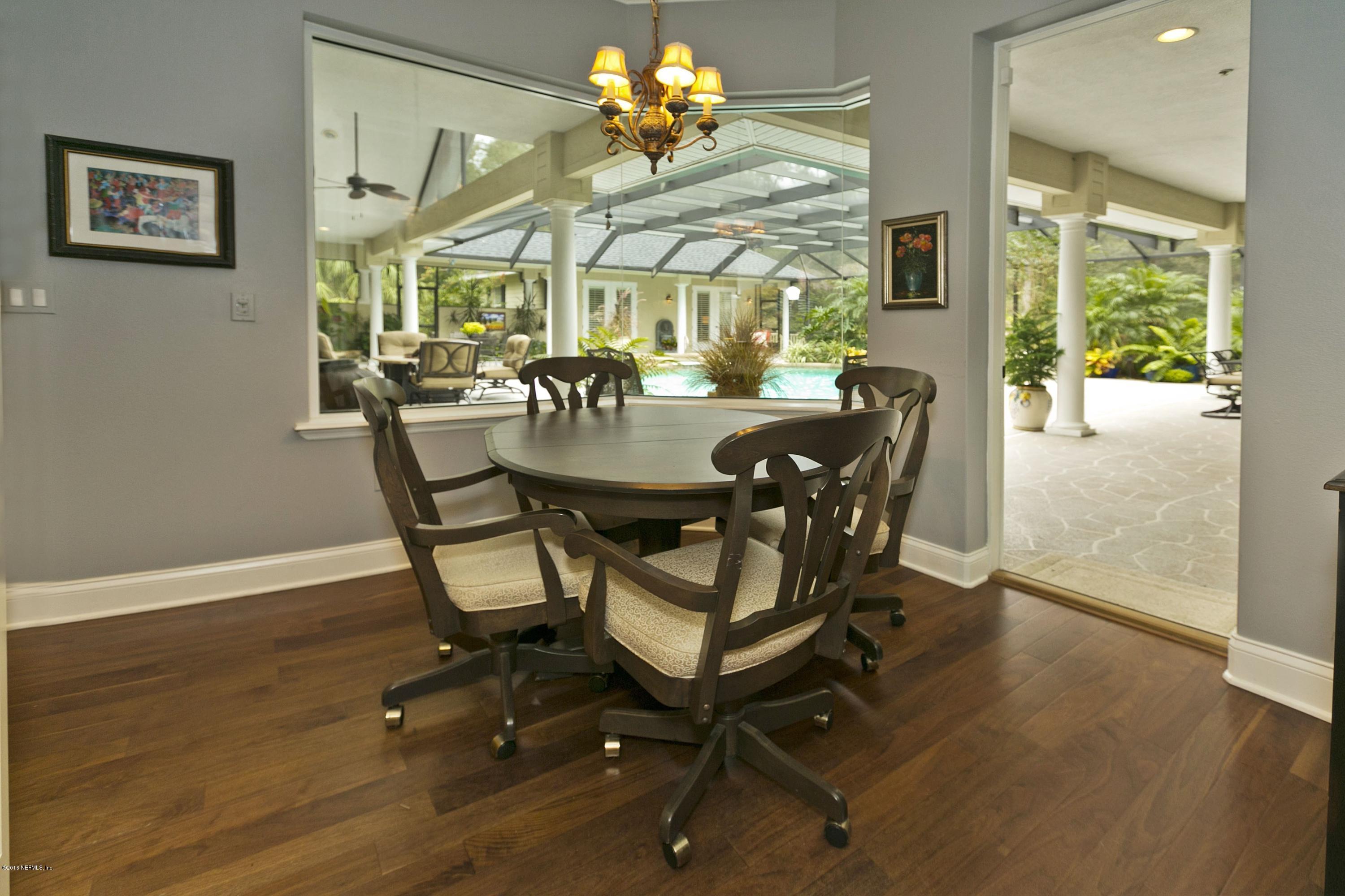 120 Dancing Horse Drive Hastings, FL 32145 - Photo 11 of 65 a view of a dining room with furniture and wooden floor