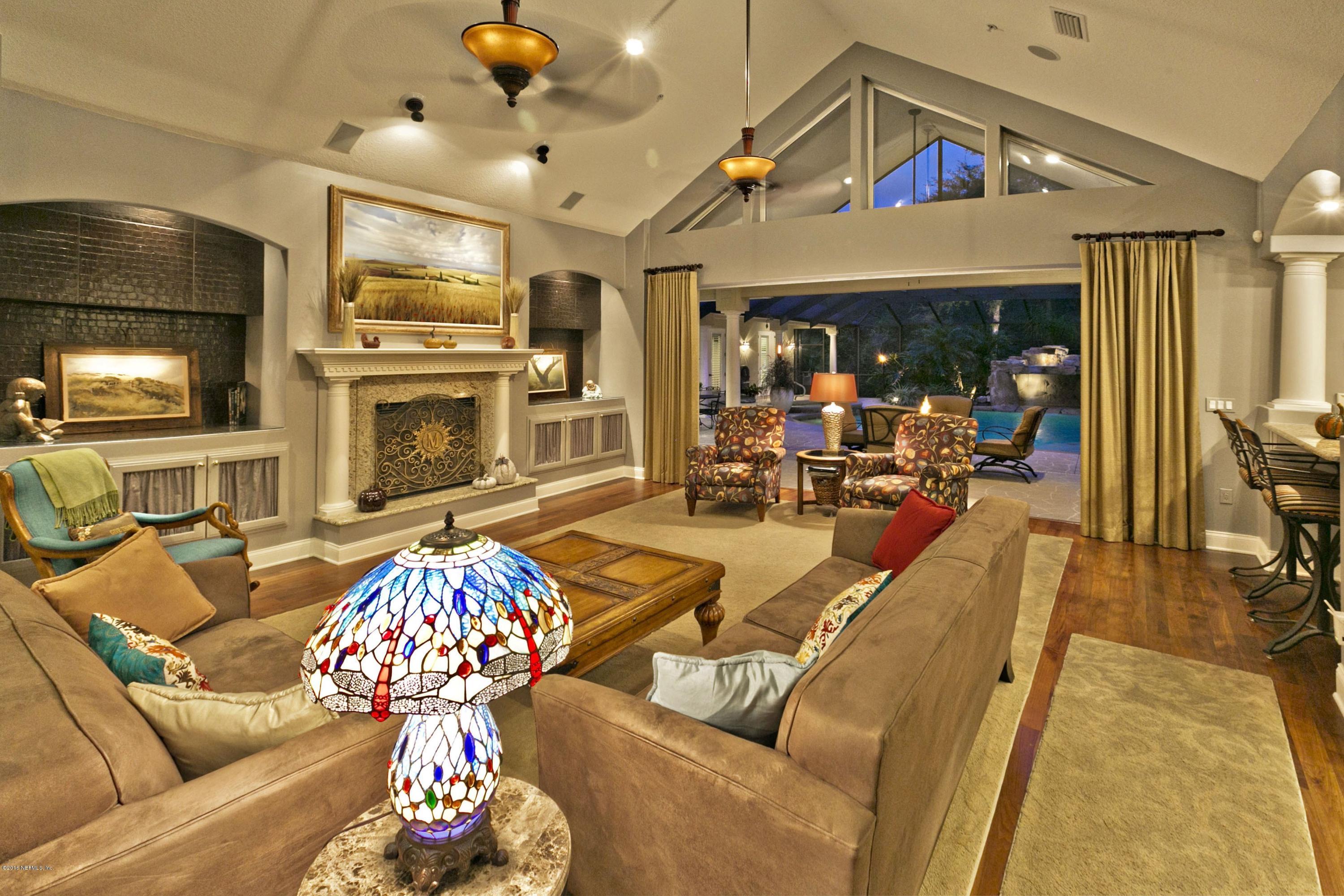 120 Dancing Horse Drive Hastings, FL 32145 - Photo 16 of 65 a living room with fireplace furniture and a flat screen tv