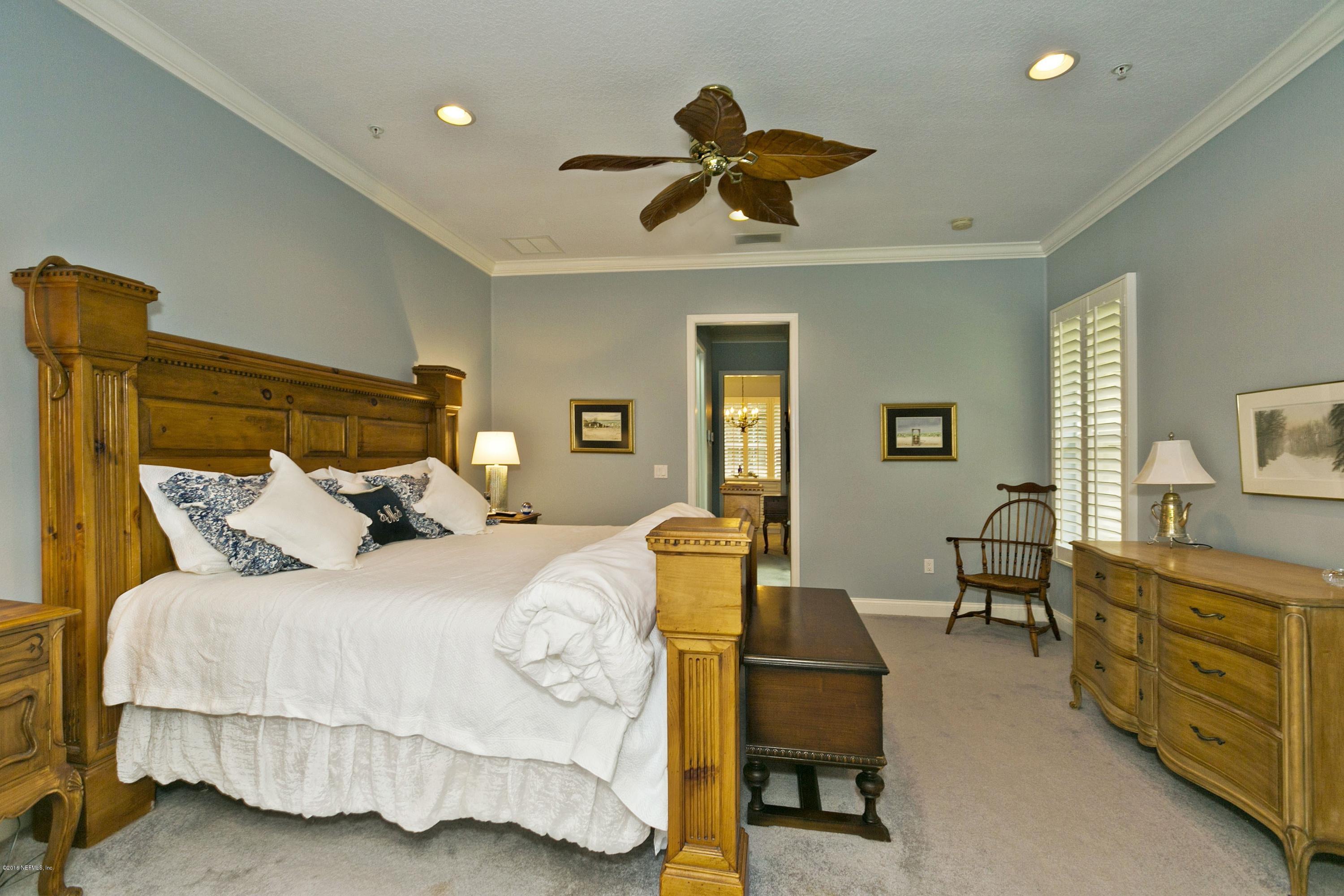 120 Dancing Horse Drive Hastings, FL 32145 - Photo 18 of 65 a bedroom with a bed and furniture