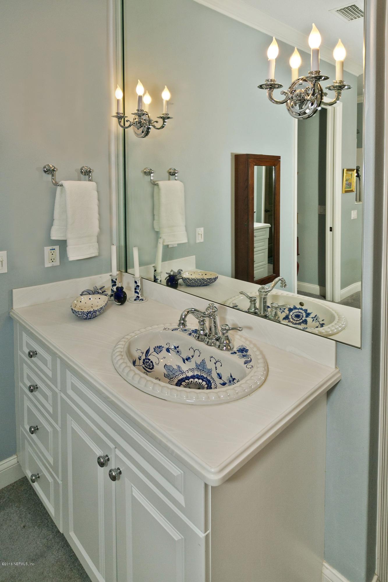 120 Dancing Horse Drive Hastings, FL 32145 - Photo 21 of 65 a bathroom with a sink and a mirror