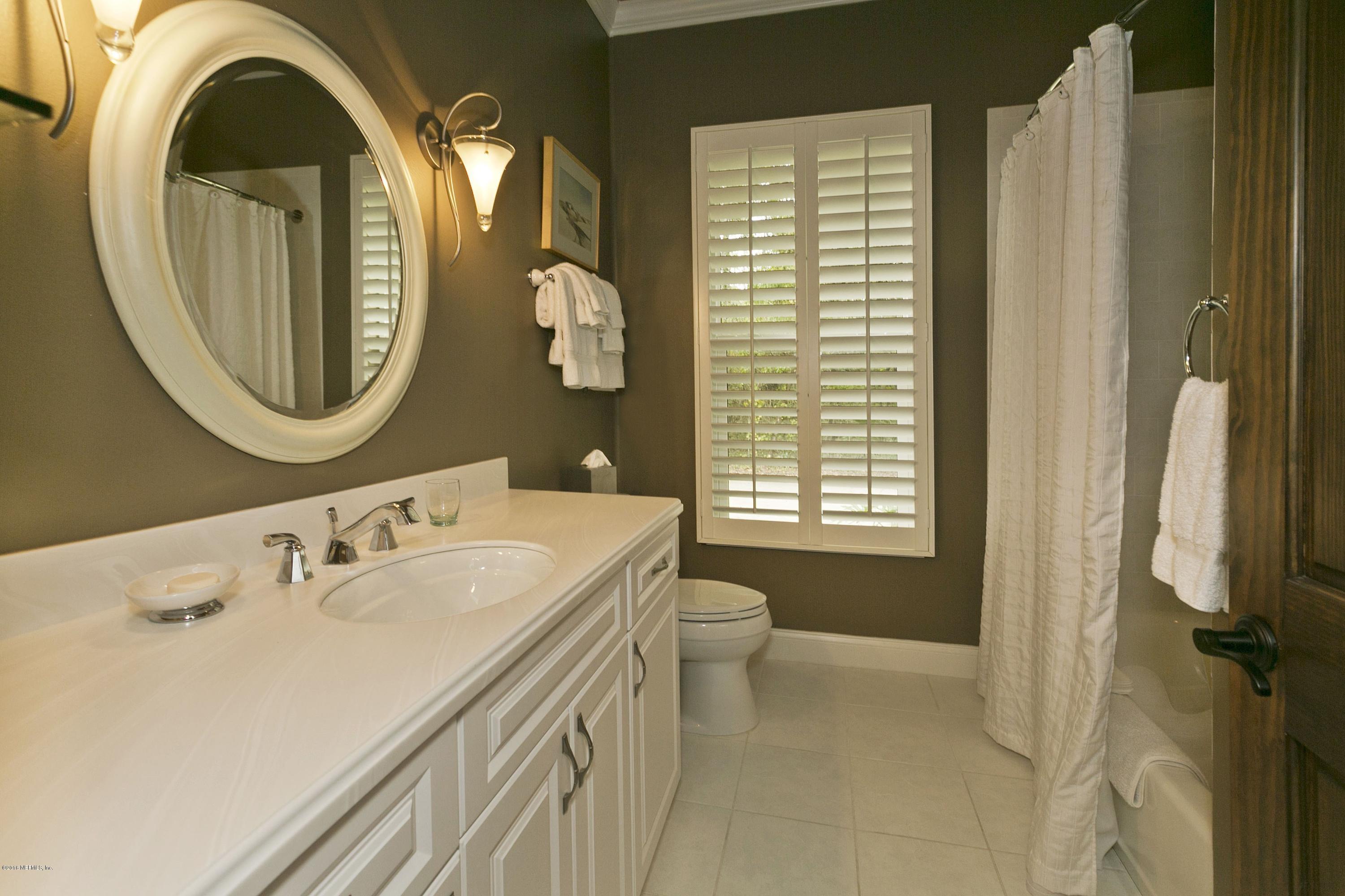 120 Dancing Horse Drive Hastings, FL 32145 - Photo 27 of 65 a bathroom with a sink and a mirror
