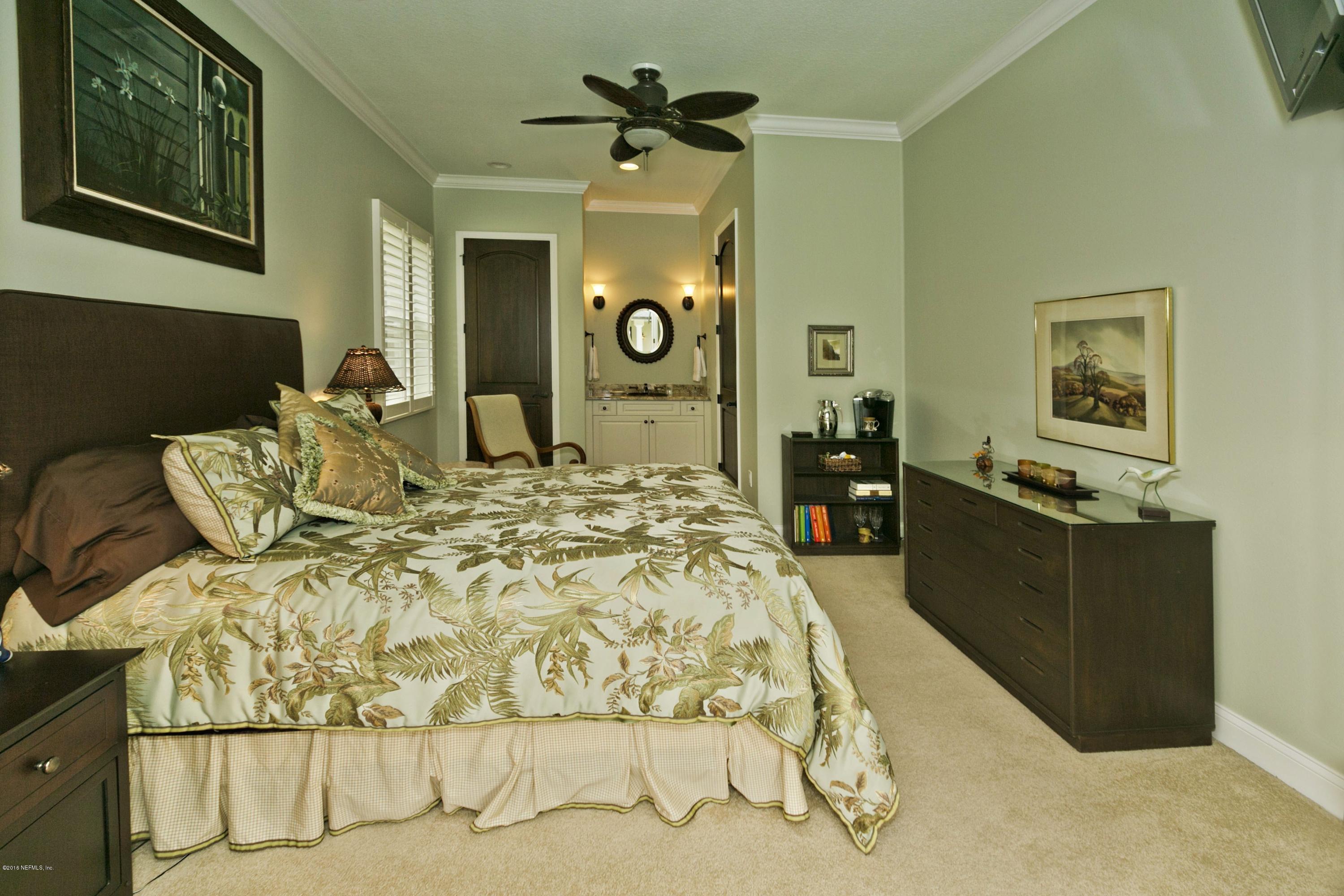 120 Dancing Horse Drive Hastings, FL 32145 - Photo 28 of 65 a bed room with a bed mirror and a dresser
