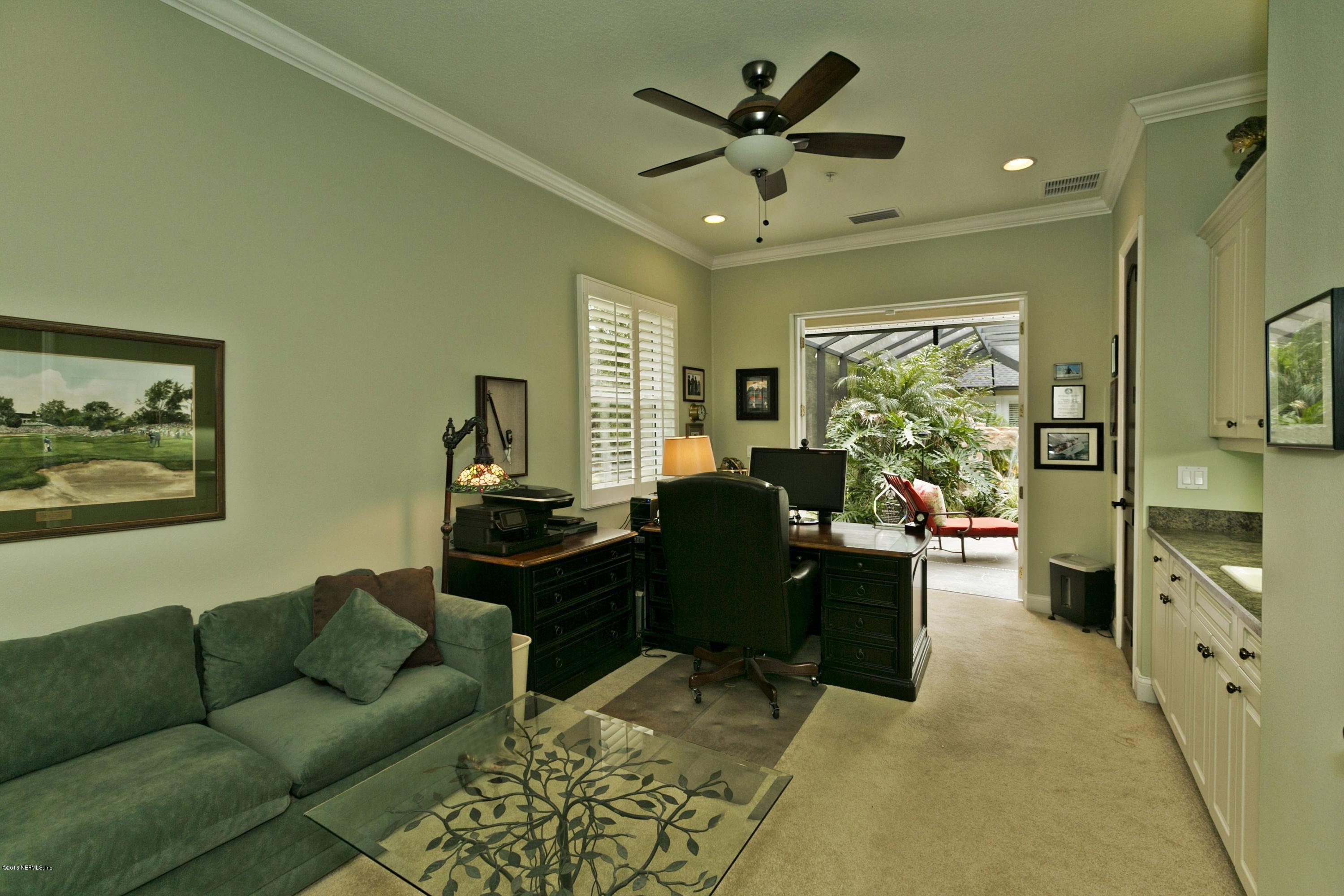 120 Dancing Horse Drive Hastings, FL 32145 - Photo 30 of 65 a living room with furniture and a large window