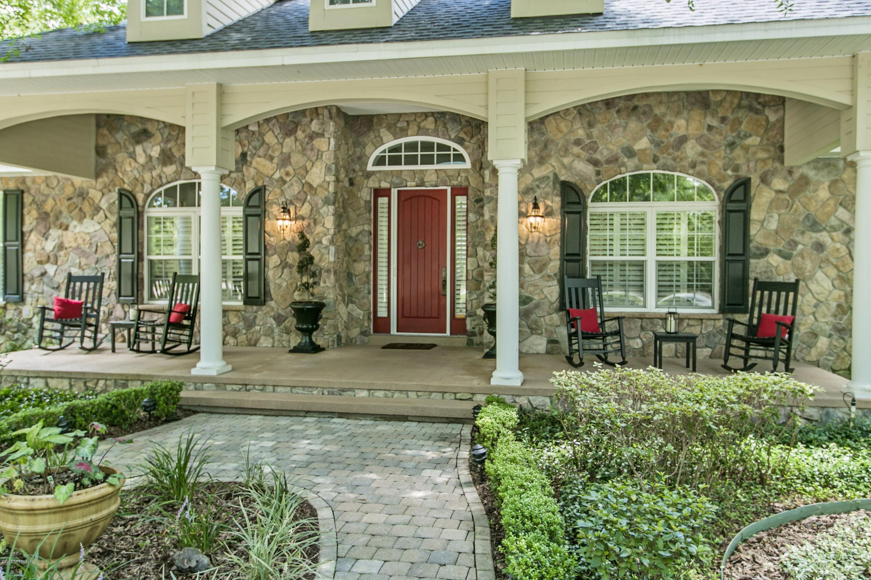 120 Dancing Horse Drive Hastings, FL 32145 - Photo 3 of 65 a front view of a house with a garden