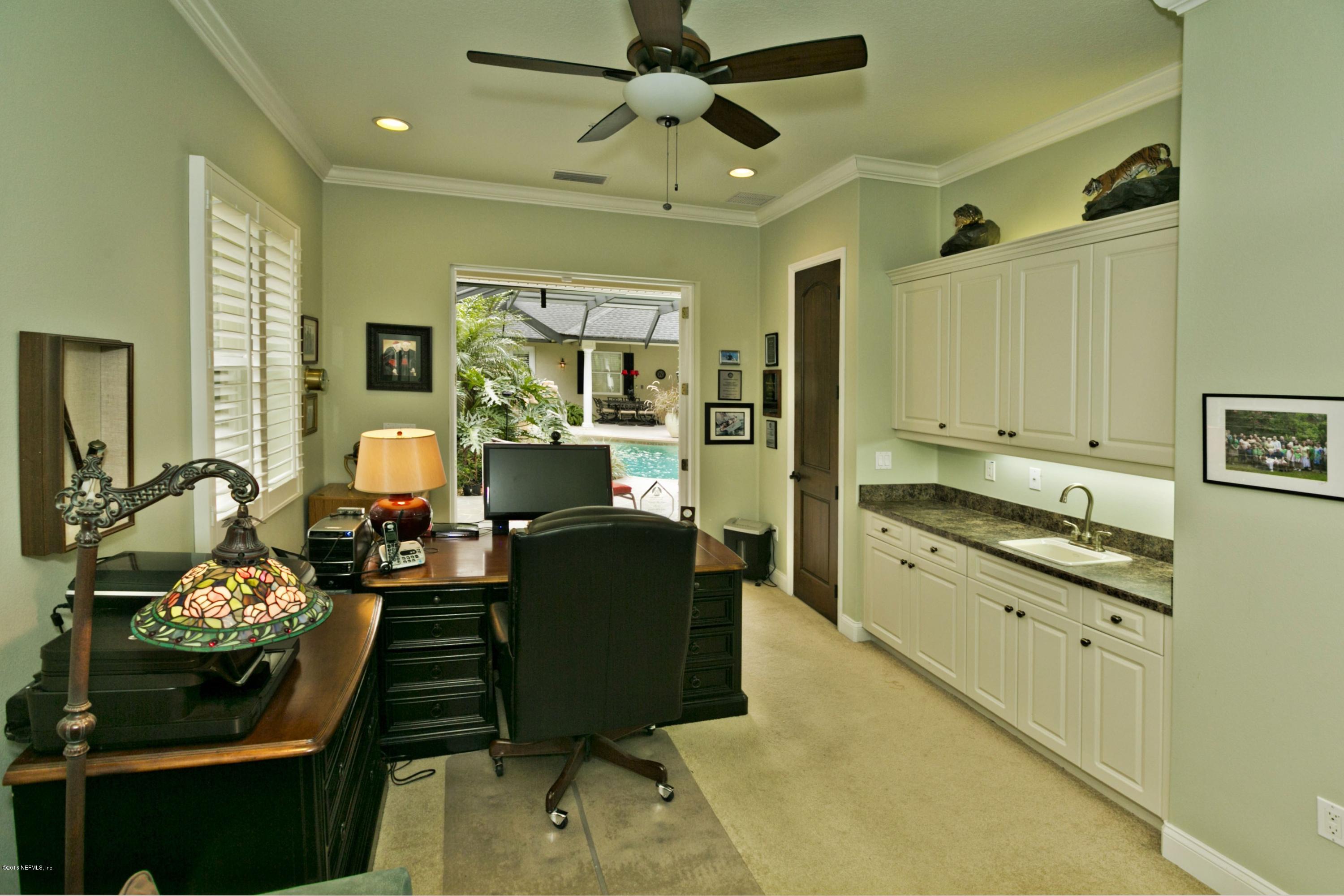 120 Dancing Horse Drive Hastings, FL 32145 - Photo 31 of 65 a kitchen with stainless steel appliances granite countertop a stove and a refrigerator