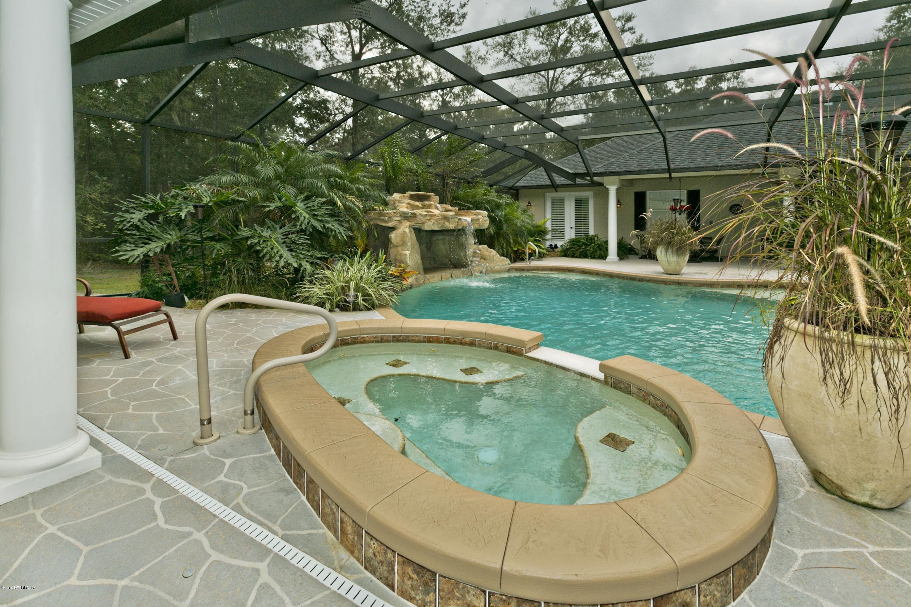 120 Dancing Horse Drive Hastings, FL 32145 - Photo 39 of 65 a view of a swimming pool with a yard