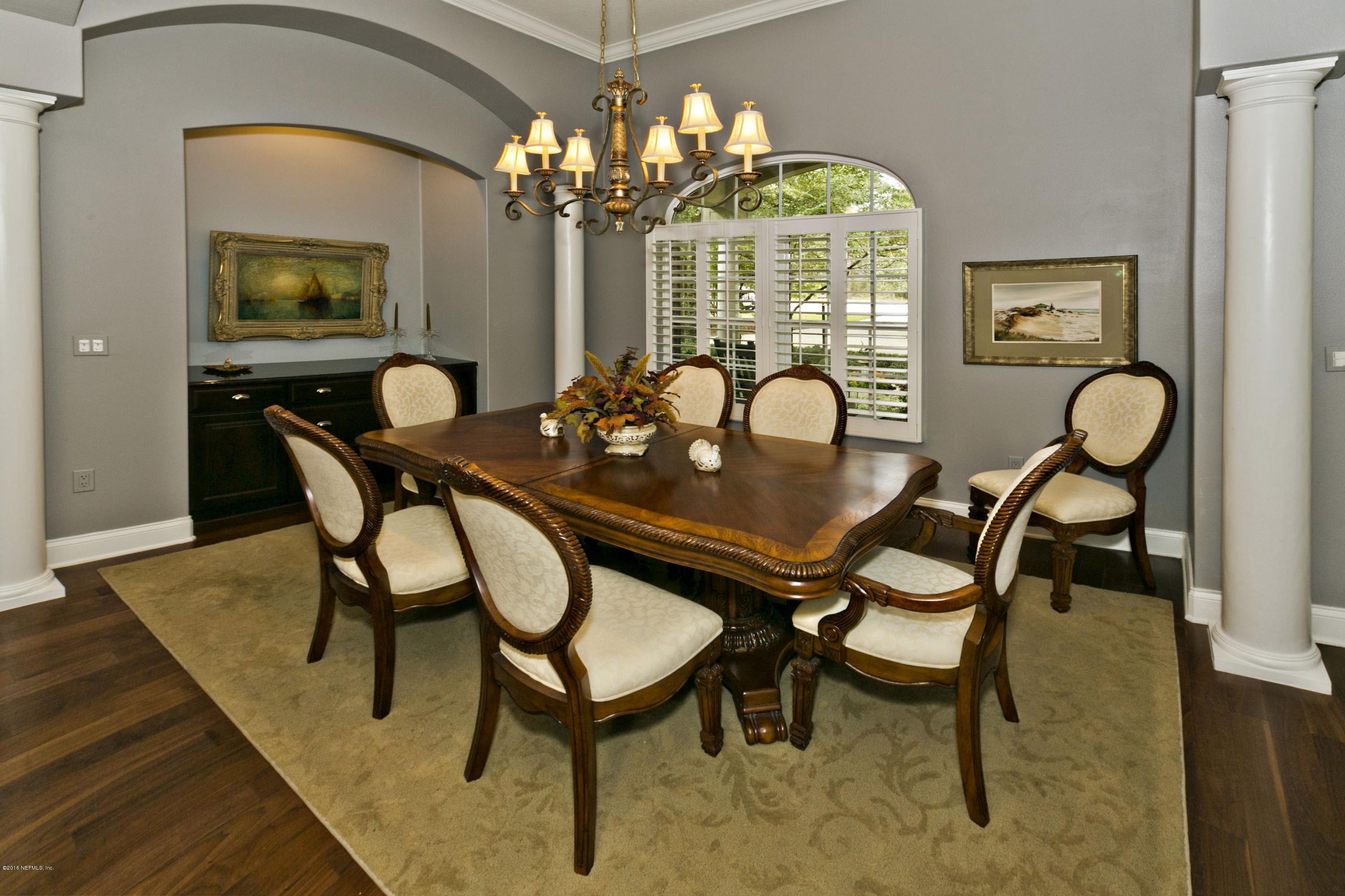 120 Dancing Horse Drive Hastings, FL 32145 - Photo 5 of 65 a dining room with furniture a chandelier and wooden floor