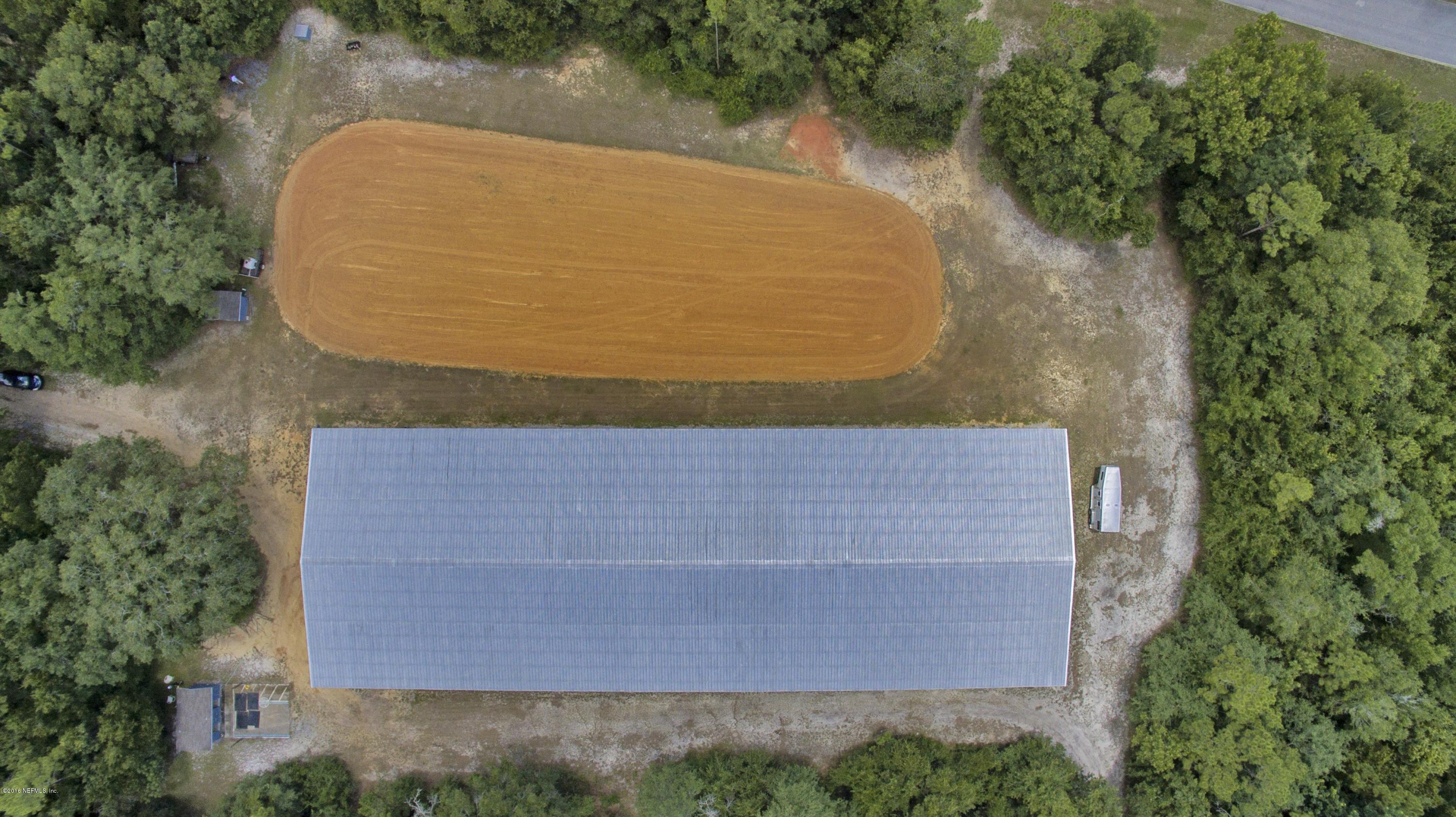 120 Dancing Horse Drive Hastings, FL 32145 - Photo 57 of 65 an aerial view of a house with a yard and large trees