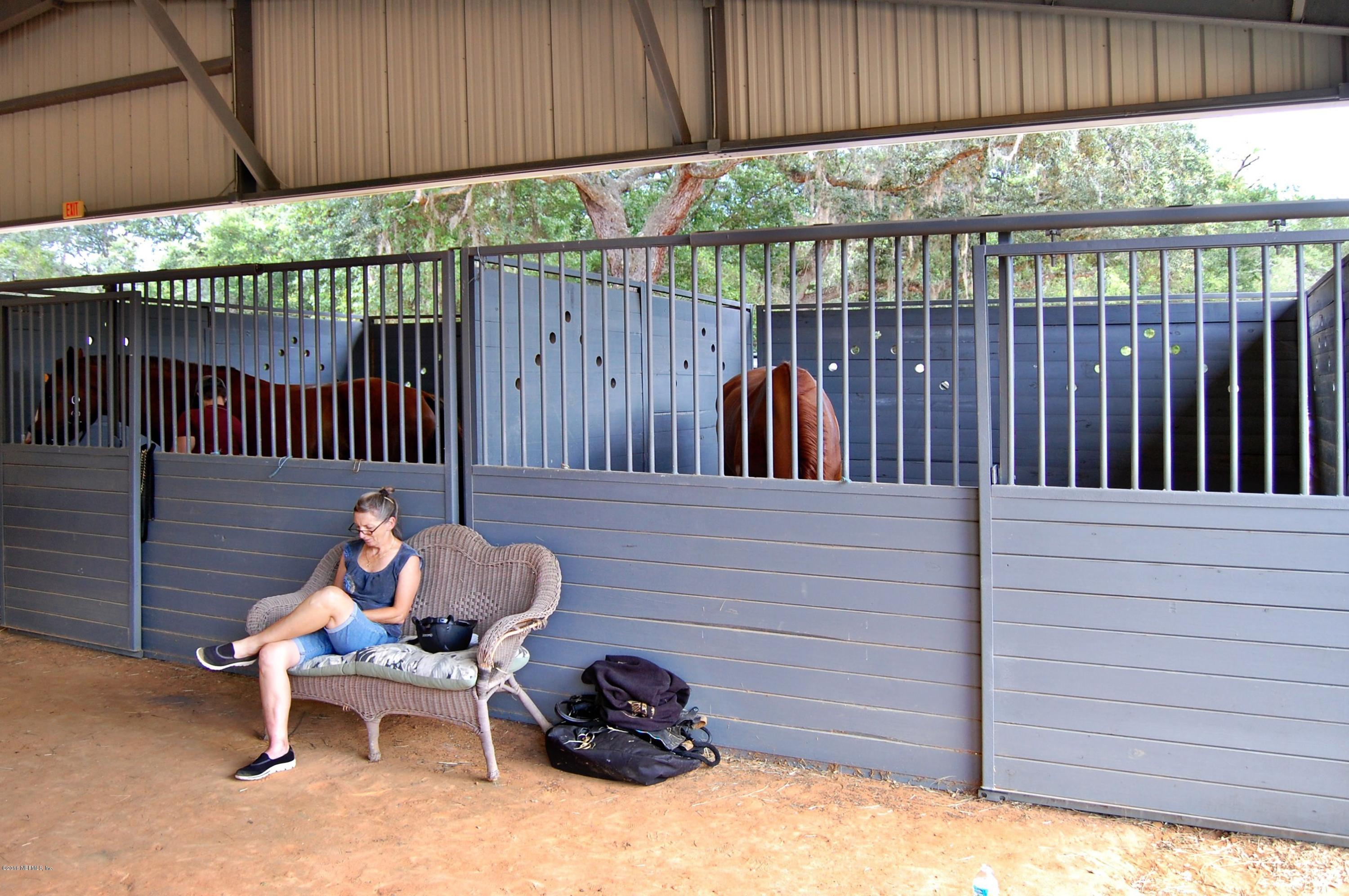 120 Dancing Horse Drive Hastings, FL 32145 - Photo 61 of 65 a wooden bench sitting in front of a wooden fence