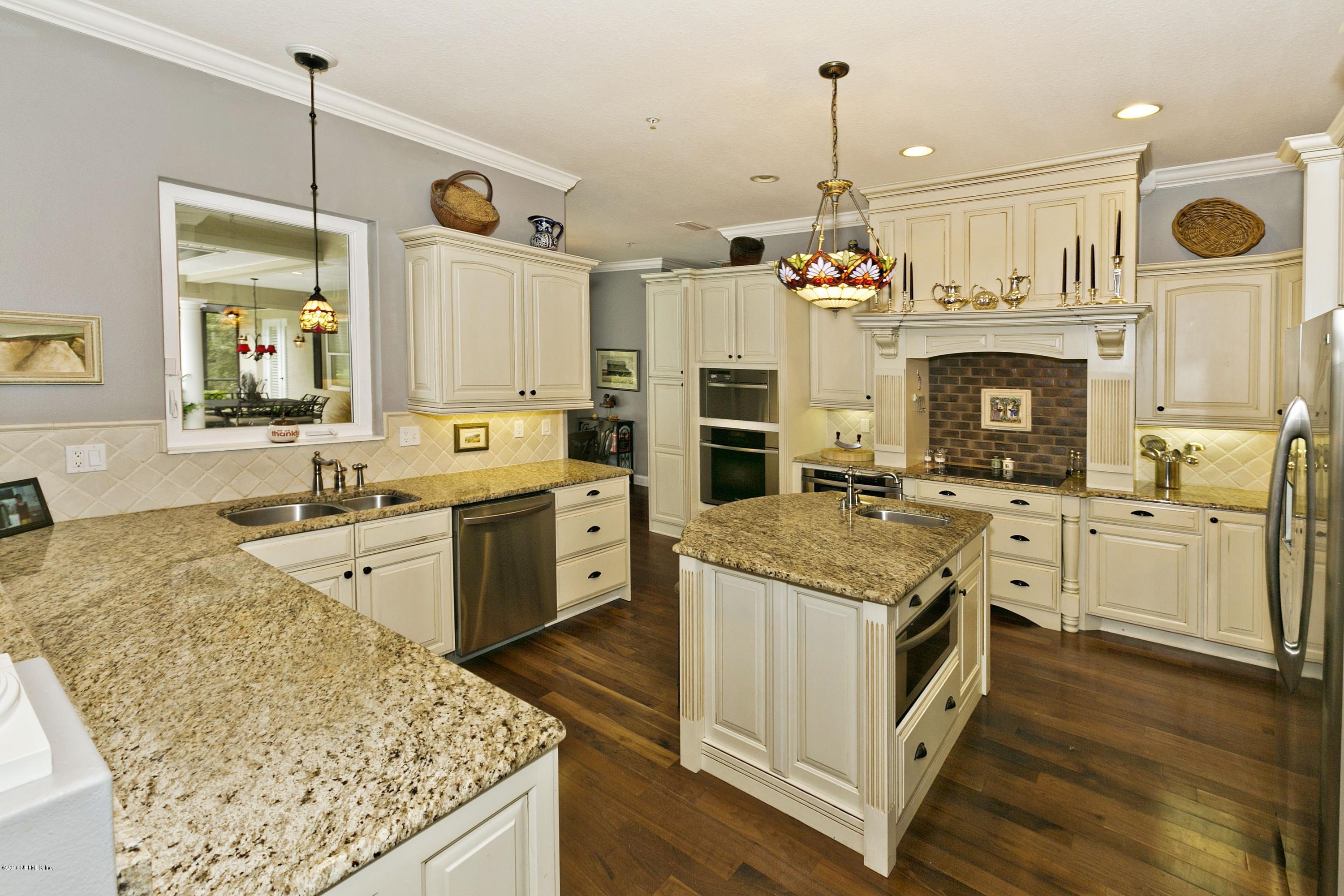 120 Dancing Horse Drive Hastings, FL 32145 - Photo 7 of 65 a kitchen that has a lot of cabinets in it