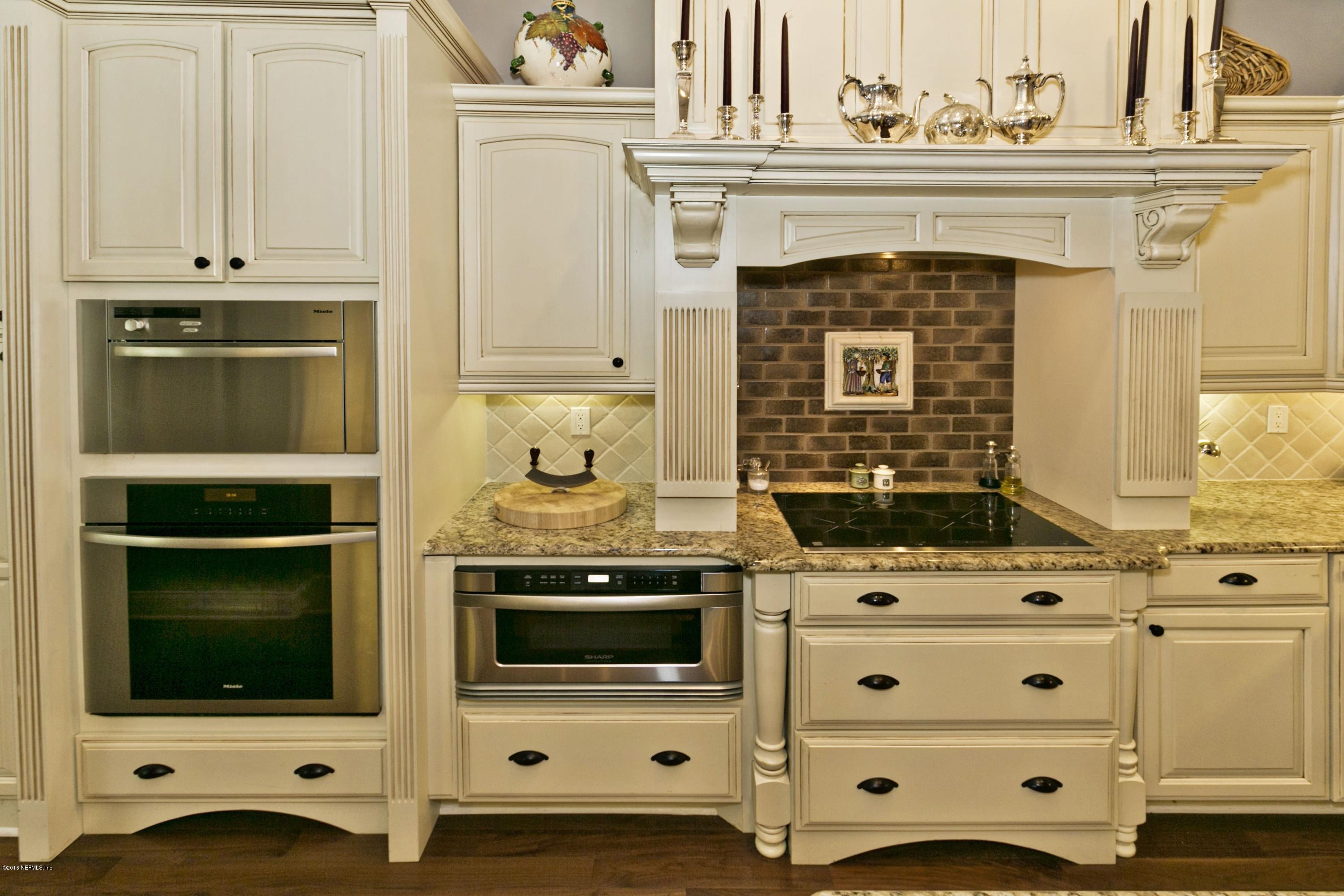 120 Dancing Horse Drive Hastings, FL 32145 - Photo 9 of 65 a stove top oven sitting inside of a kitchen