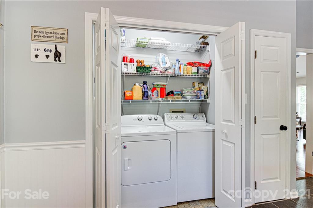 10715 Spruce Mountain Road Charlotte, NC 28214 - Photo 17 of 33 a view of storage and utility room with racks on the wall