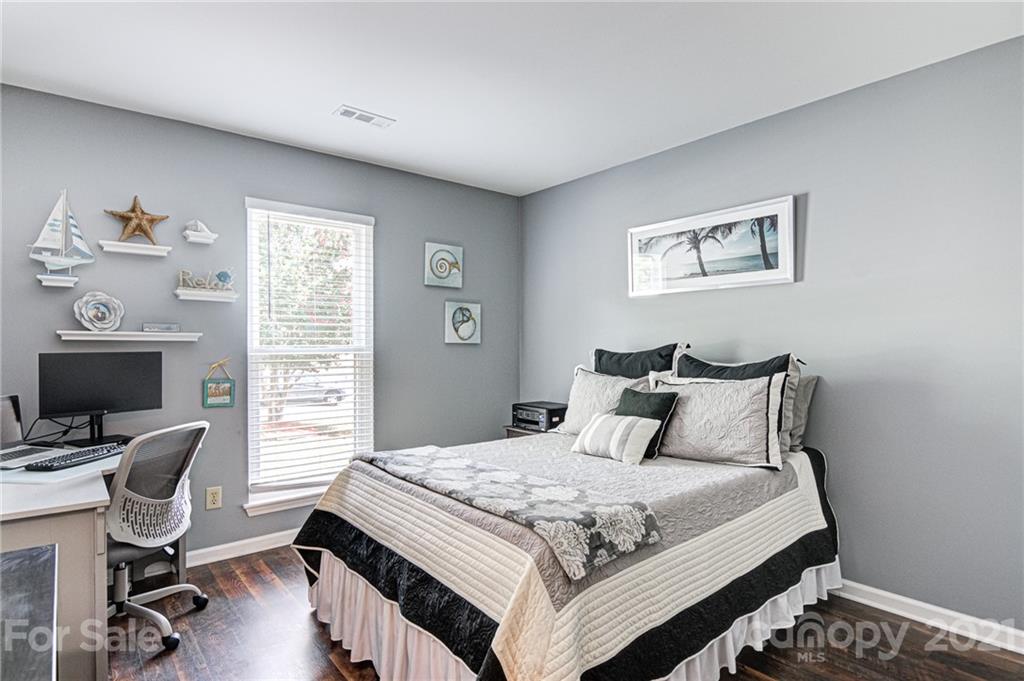 10715 Spruce Mountain Road Charlotte, NC 28214 - Photo 25 of 33 a bedroom with a bed and a window