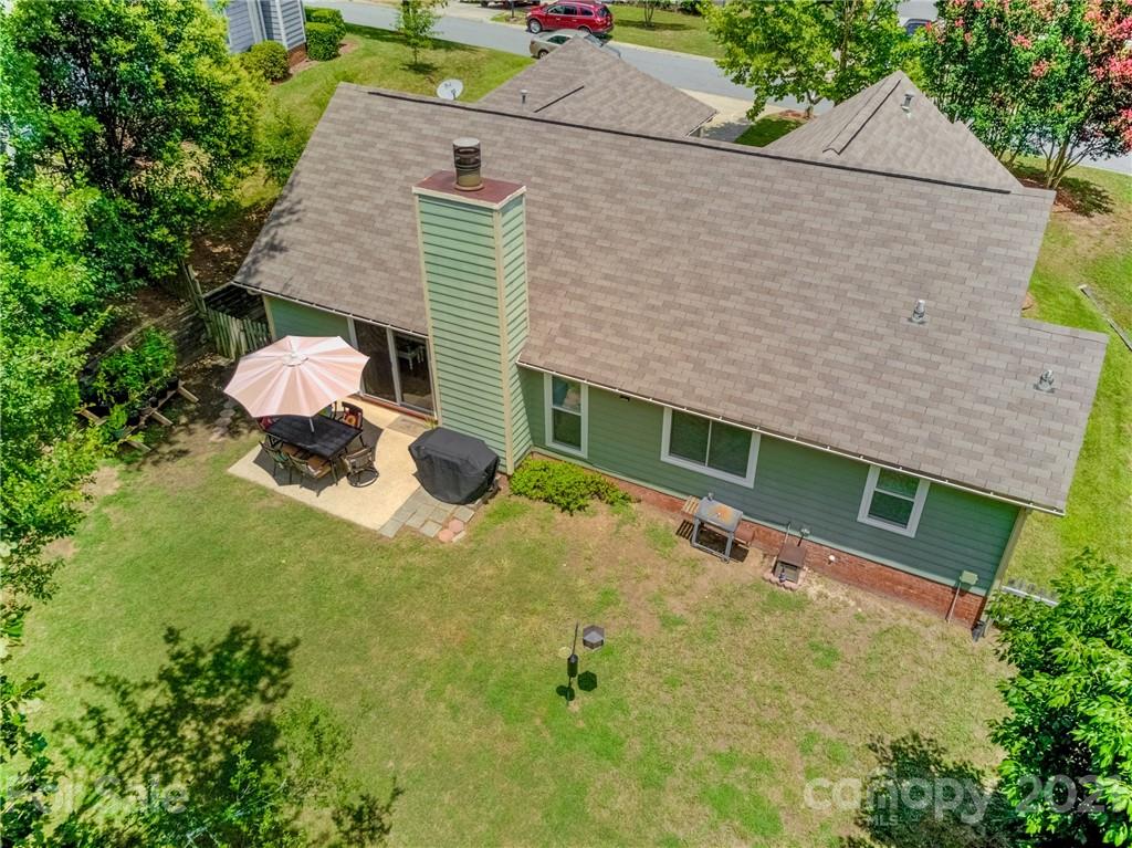 10715 Spruce Mountain Road Charlotte, NC 28214 - Photo 32 of 33 a backyard of a house with potted plants