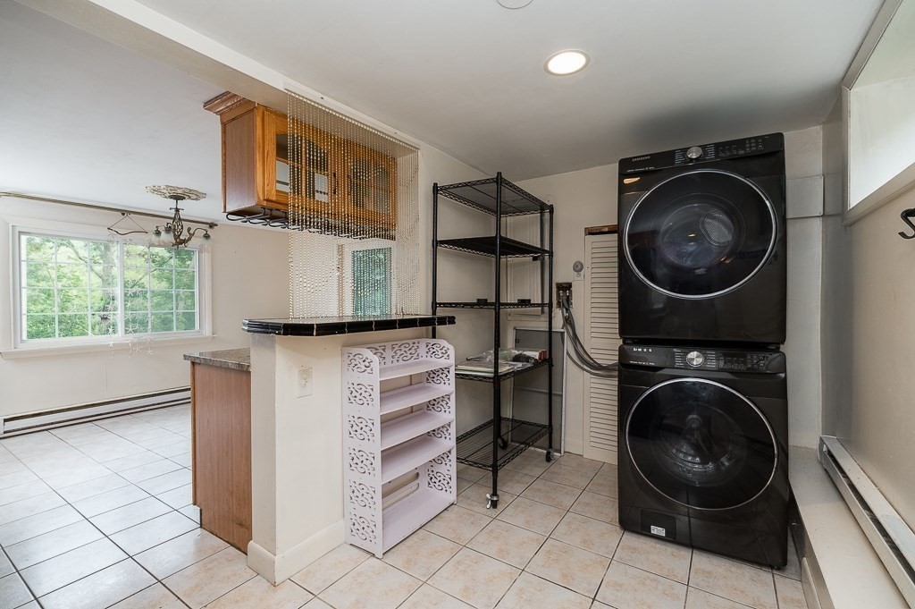 133 Thatcher Road Gloucester, MA 01930 - Photo 13 of 32 a view of a washer and dryer in a utility room