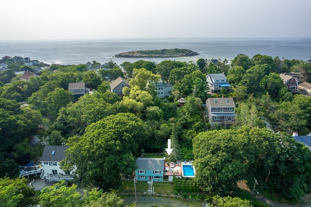 133 Thatcher Road Gloucester, MA 01930 - Photo 2 of 32 an aerial view of a house with a garden