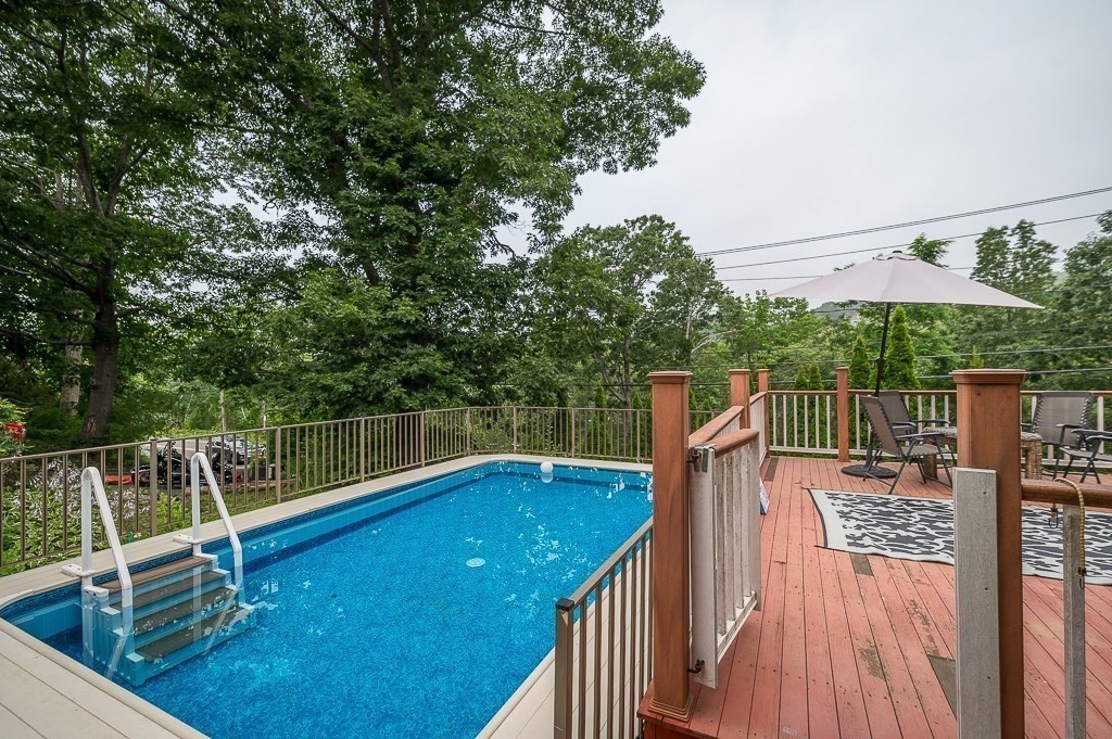 133 Thatcher Road Gloucester, MA 01930 - Photo 22 of 32 a view of a roof deck with wooden floor and barbeque oven