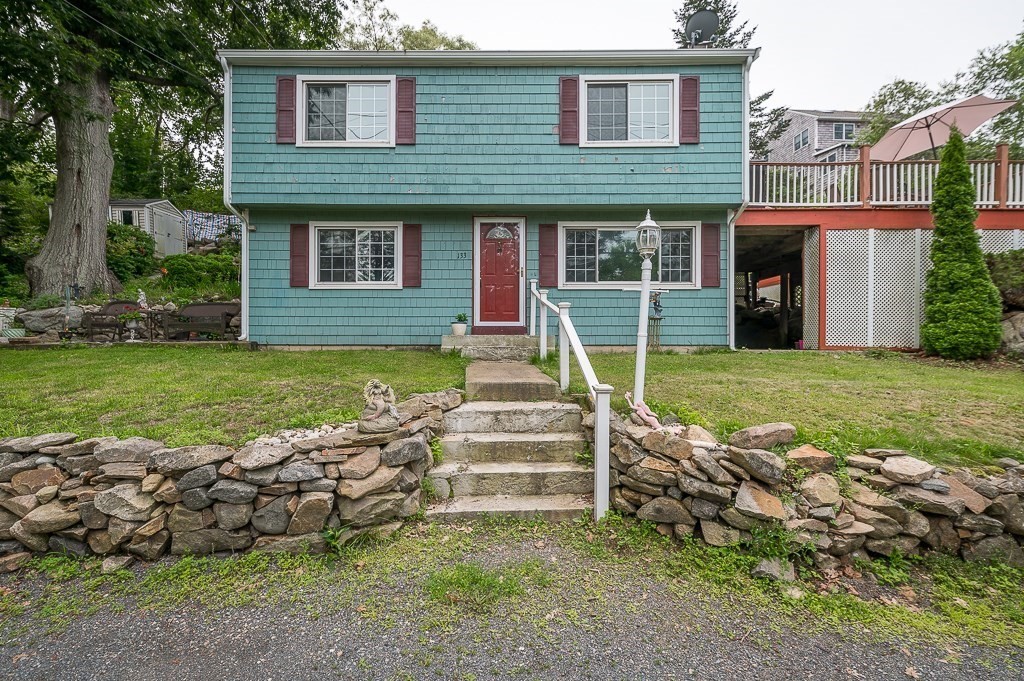 133 Thatcher Road Gloucester, MA 01930 - Photo 25 of 32 a view of a house with a yard