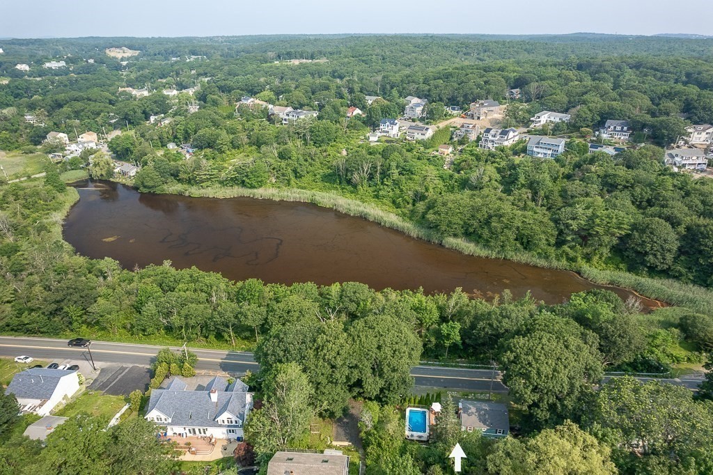 133 Thatcher Road Gloucester, MA 01930 - Photo 5 of 32 an aerial view of a houses with a yard and lake