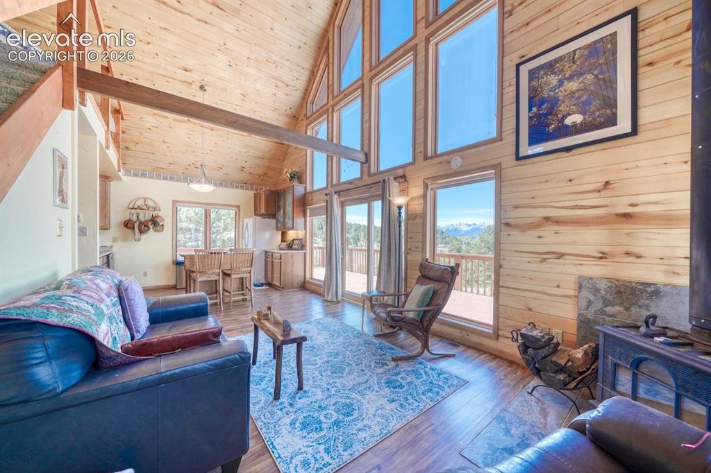 489 Excelsior Road Westcliffe, CO 81252 - Photo 11 of 34 a living room with furniture or couch and a table