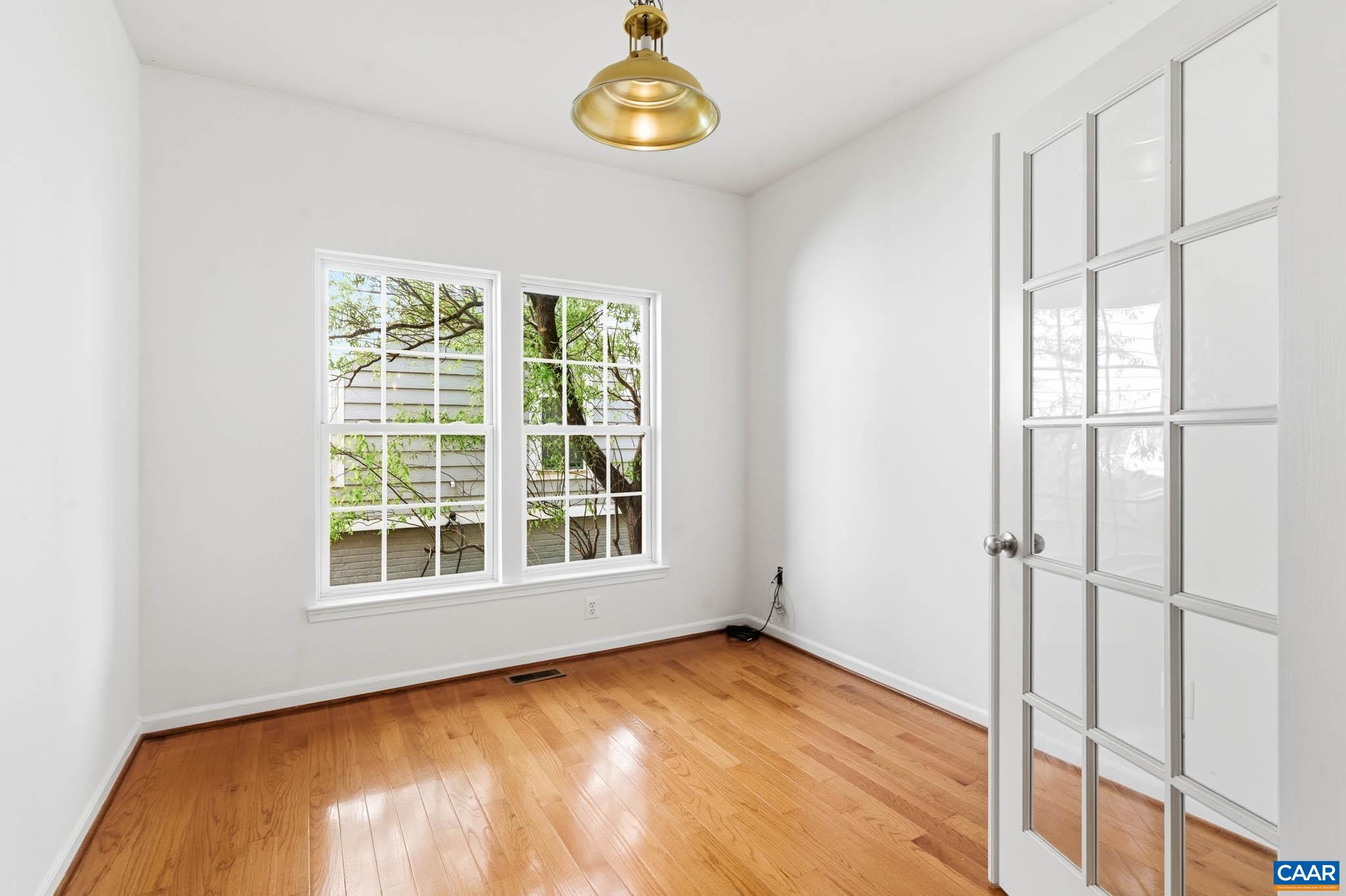 700 Rainier Road Charlottesville, VA 22903 - Photo 16 of 41 Private office space with hardwood floors and natural light, ideal for remote work or study.