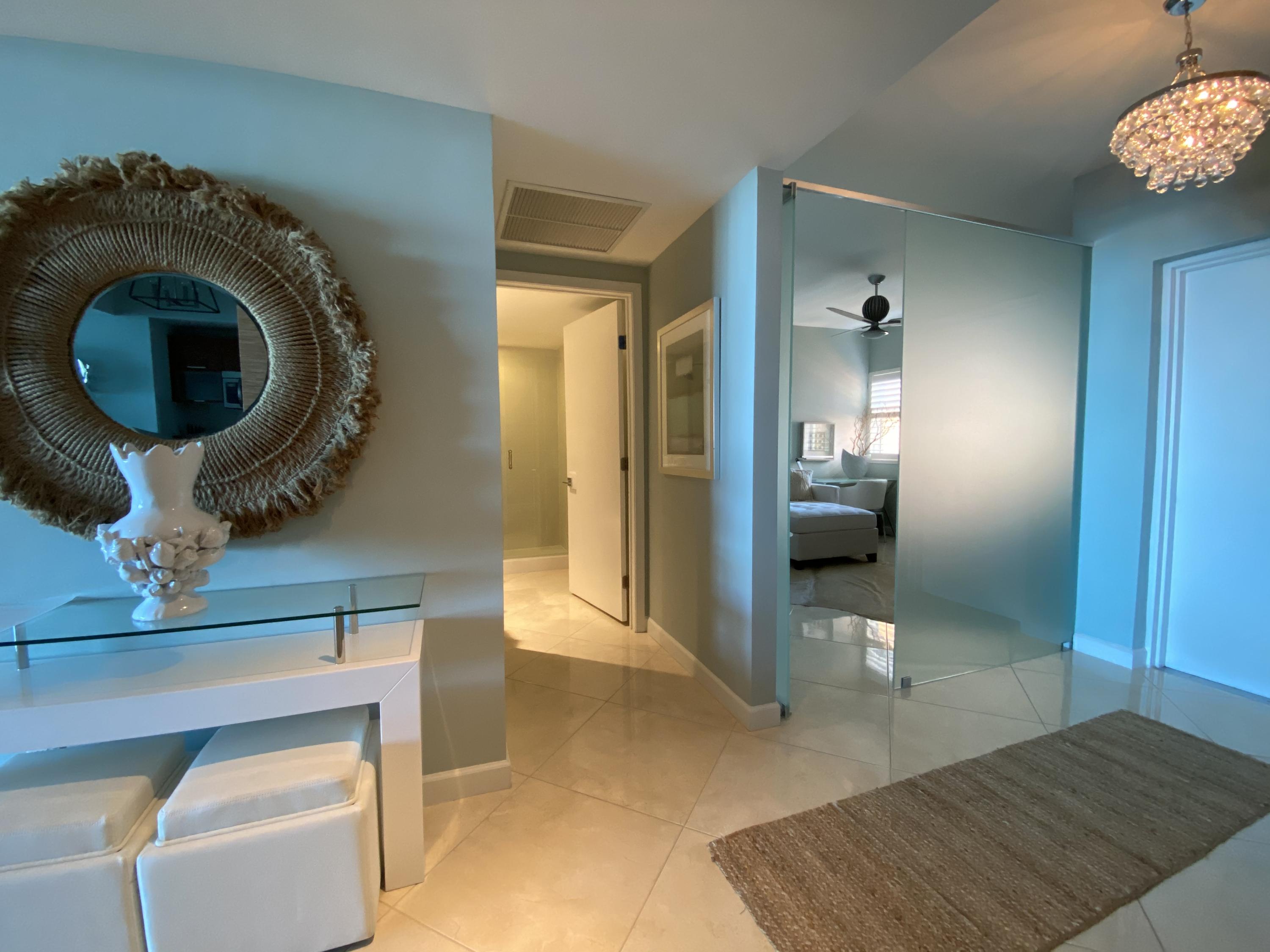 2640 Lake Shore Drive, Unit 2211 Riviera Beach, FL 33404 - Photo 2 of 27 Foyer & Guest Bath