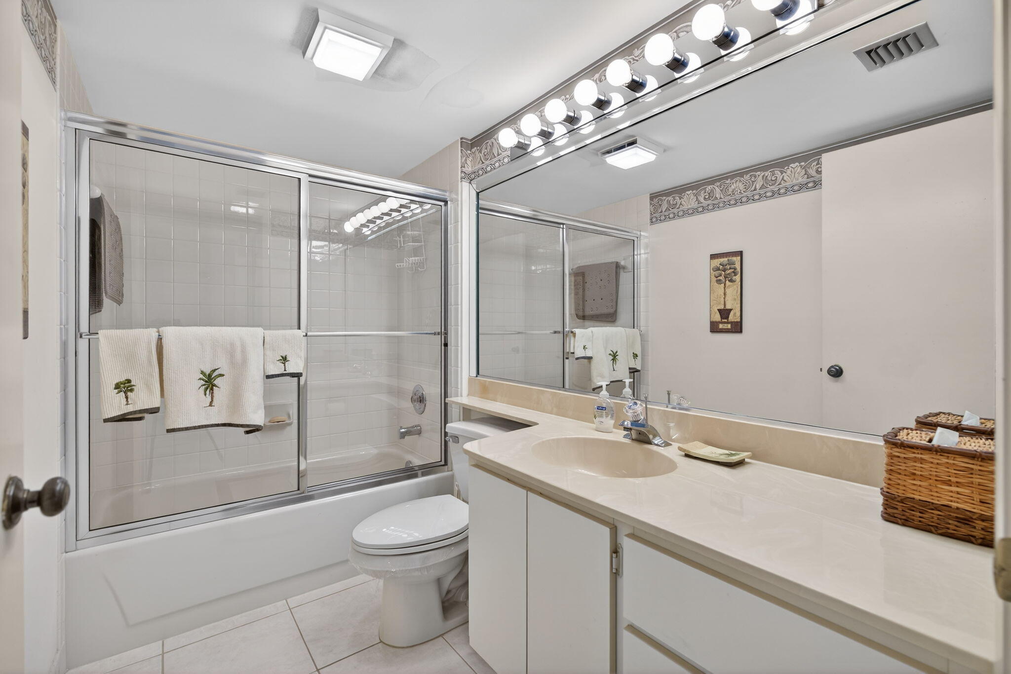 2601 Village Boulevard, Unit 303 West Palm Beach, FL 33409 - Photo 17 of 23 a bathroom with a sink a toilet and shower