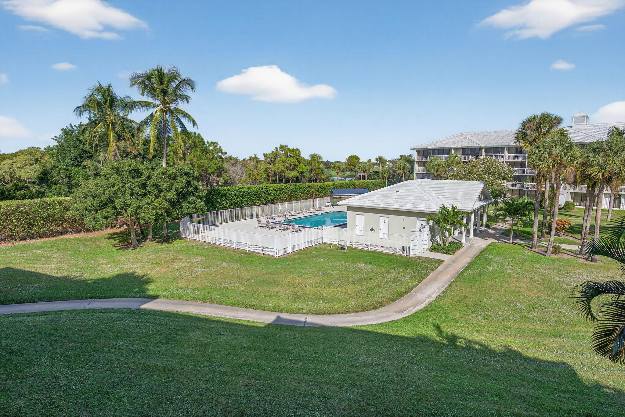 2601 Village Boulevard, Unit 303 West Palm Beach, FL 33409 - Photo 22 of 23 a view of a house with a swimming pool