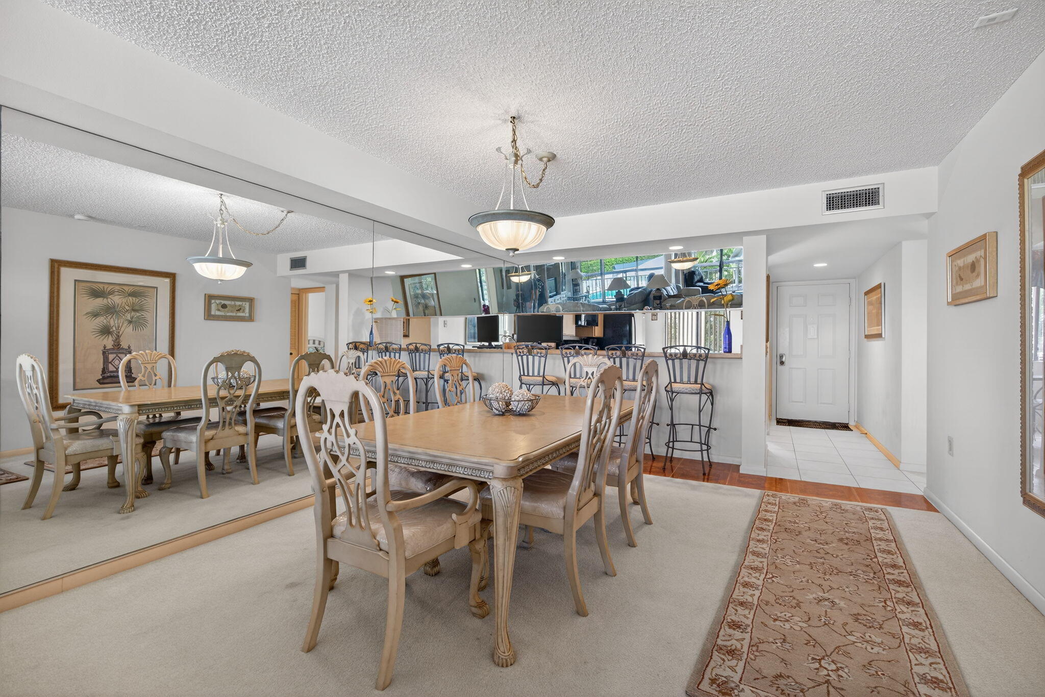 2601 Village Boulevard, Unit 303 West Palm Beach, FL 33409 - Photo 7 of 23 a view of a dining room with furniture