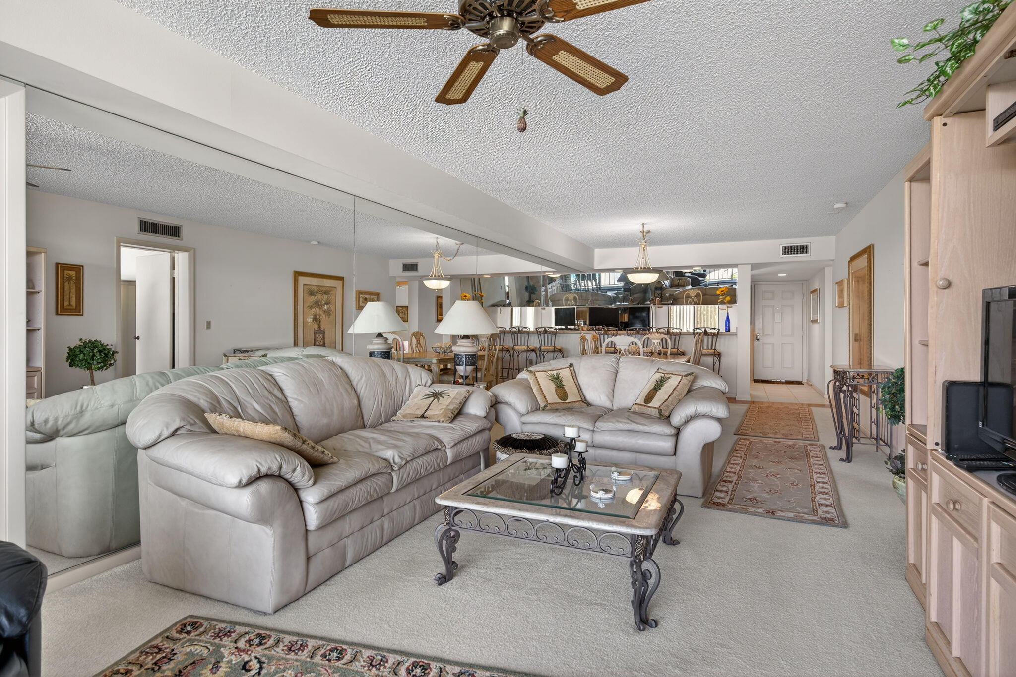 2601 Village Boulevard, Unit 303 West Palm Beach, FL 33409 - Photo 9 of 23 a living room with furniture