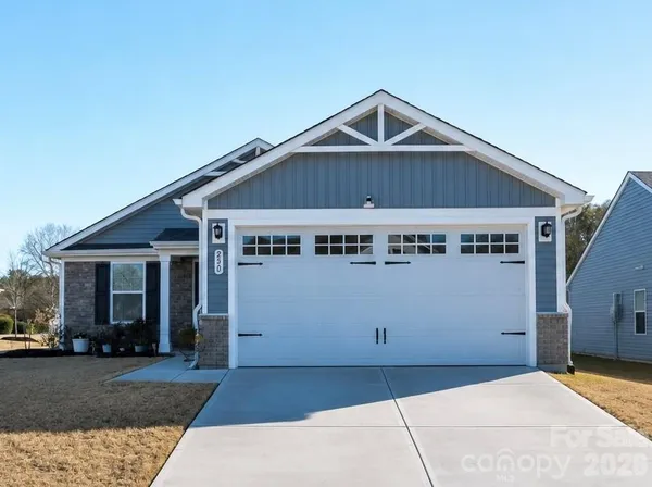 a front view of a house with garage