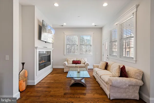 a view of a room with wooden floor