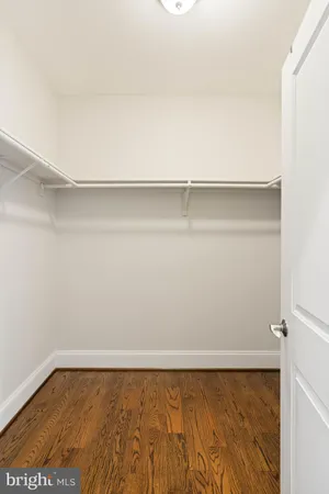 a room with gym equipment pool table furniture and windows