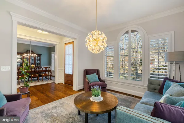 a large kitchen with kitchen island a island a stove a table and chairs in it