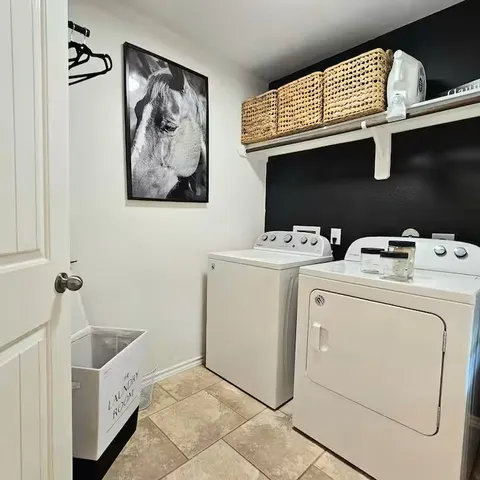 a utility room with dryer and washer