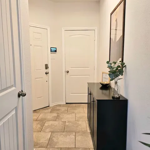 a view of a bathroom with a sink and mirror