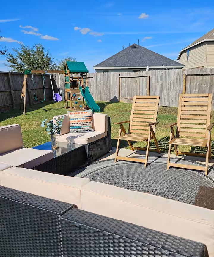14006 Embrystone Lane Houston, TX 77047 - Photo 13 of 13 a view of a patio with table and chairs with wooden floor and fence
