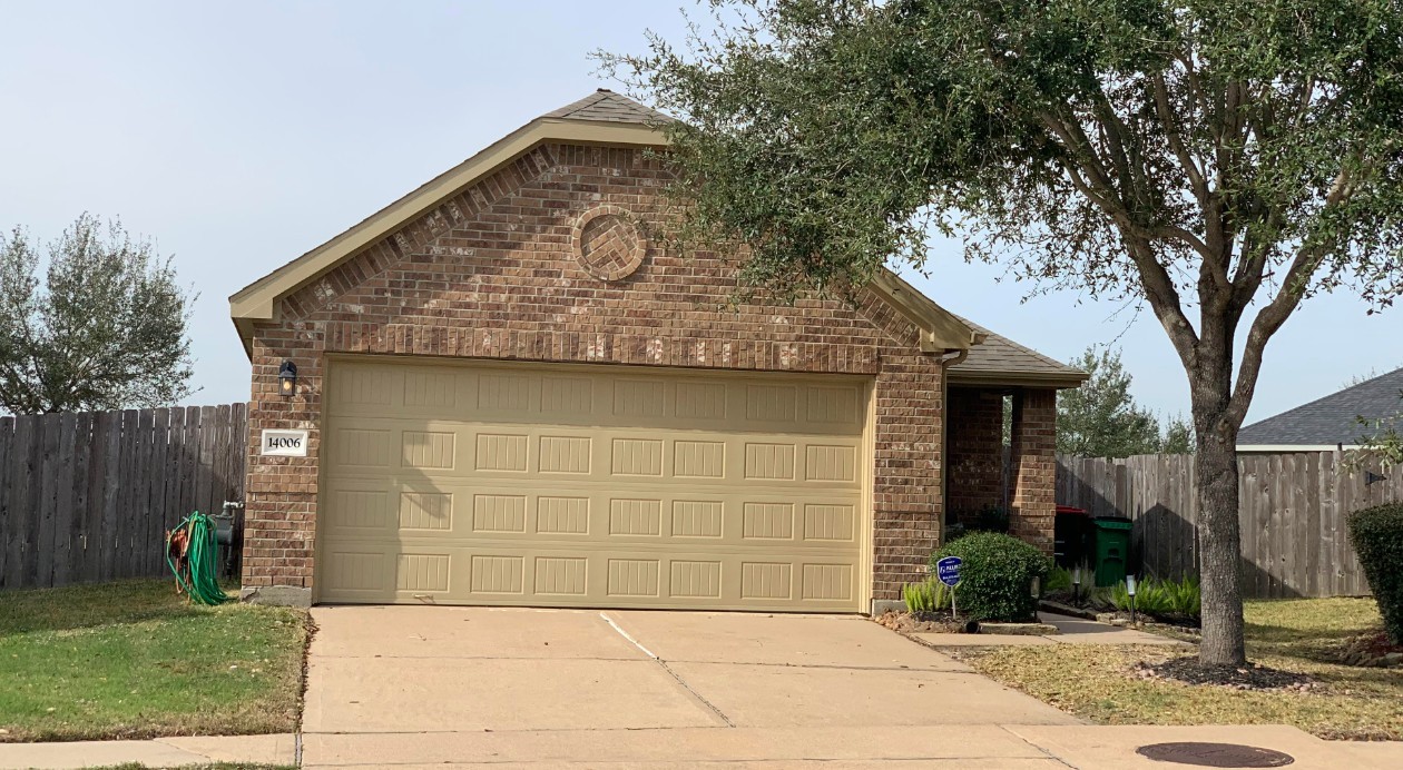 14006 Embrystone Lane Houston, TX 77047 - Photo 2 of 13 a front view of a house with garden