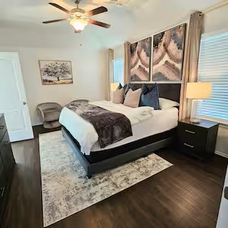 14006 Embrystone Lane Houston, TX 77047 - Photo 5 of 13 a bed room with a bed and a couch