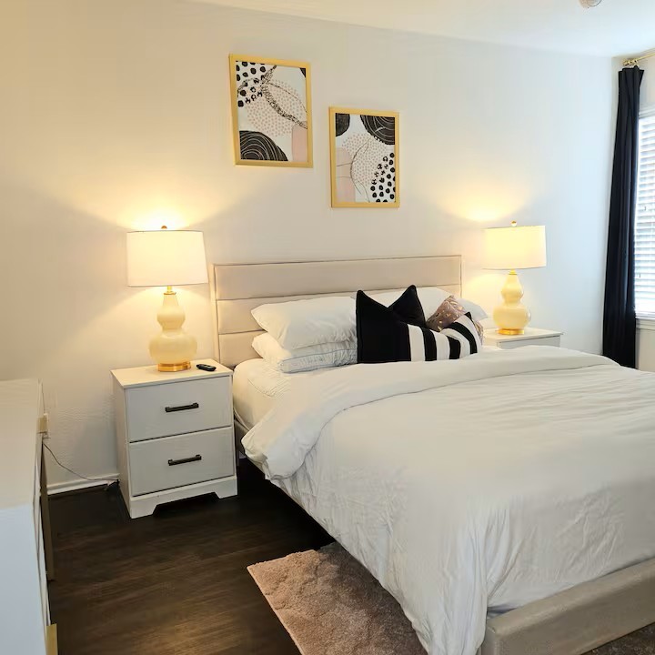 14006 Embrystone Lane Houston, TX 77047 - Photo 8 of 13 a bedroom with a bed and a night stand