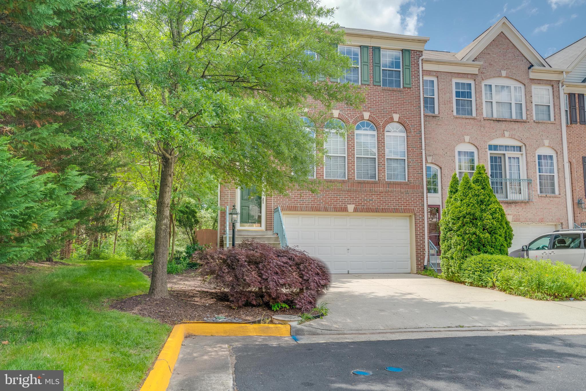 13641 Cedar Run Lane Herndon, VA 20171 - Photo 2 of 56 a front view of a house with a yard