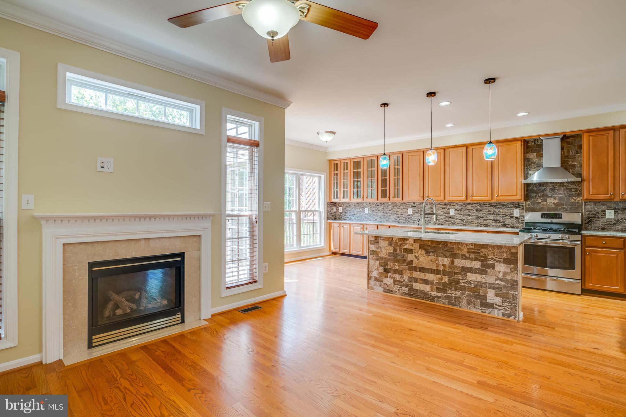 13641 Cedar Run Lane Herndon, VA 20171 - Photo 12 of 56 a view of kitchen with granite countertop stainless steel appliances and wooden floor